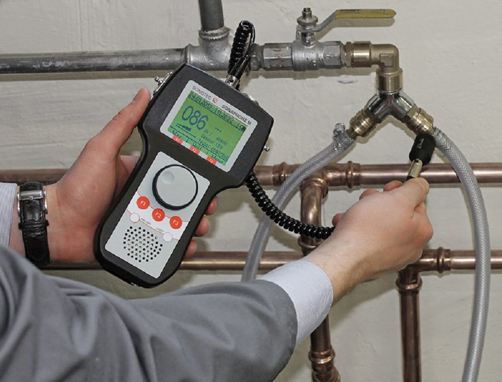 Plumber testing pipes with electronic leak detection equipment in Spring Valley