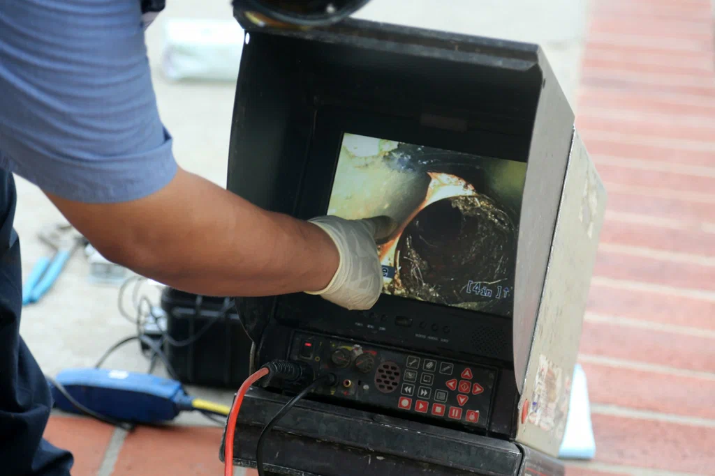 Technician viewing a drain inspection camera in Spring Valley
